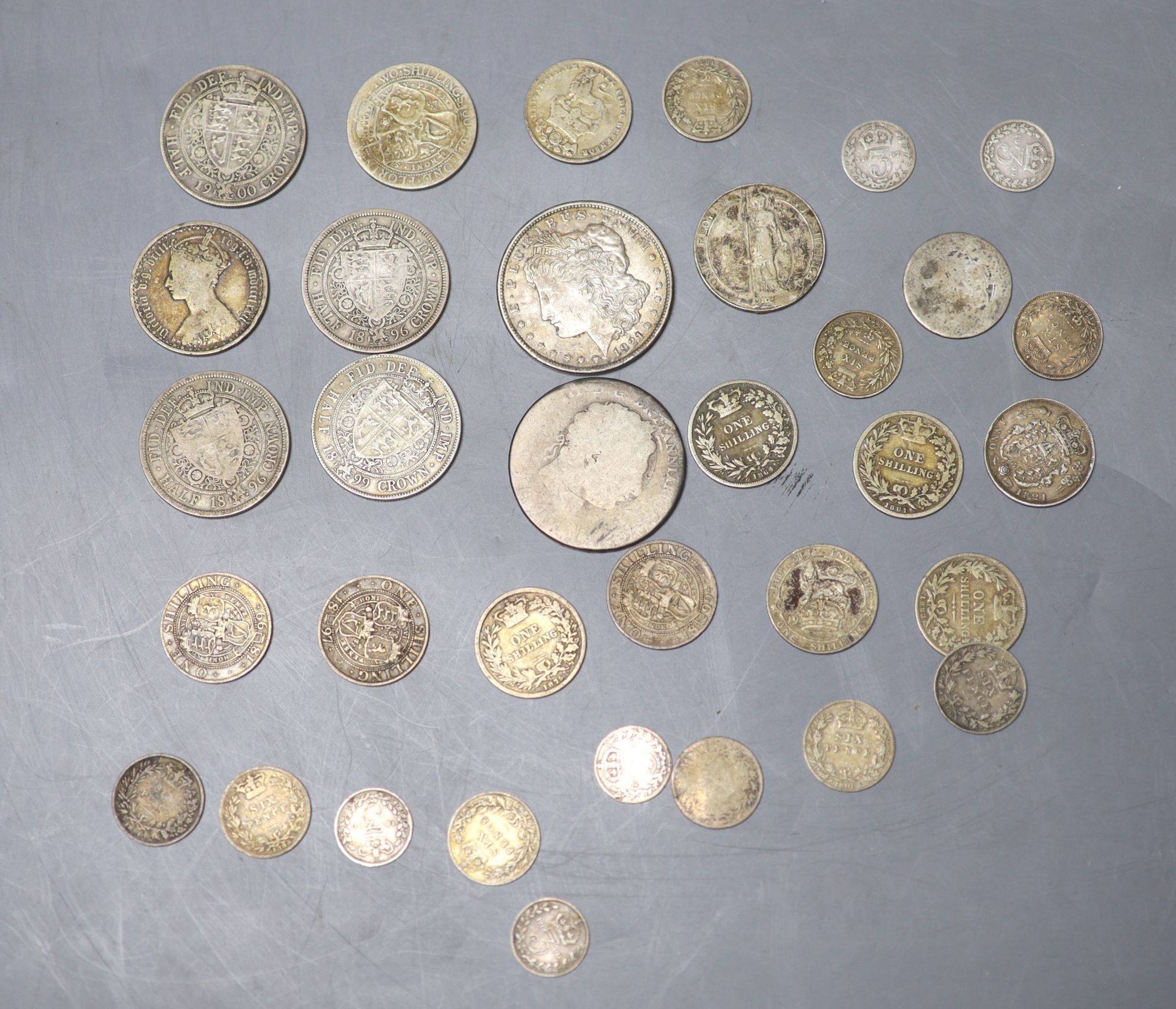 A collection of UK and world coins including George IV - George V silver threepences to halfcrowns